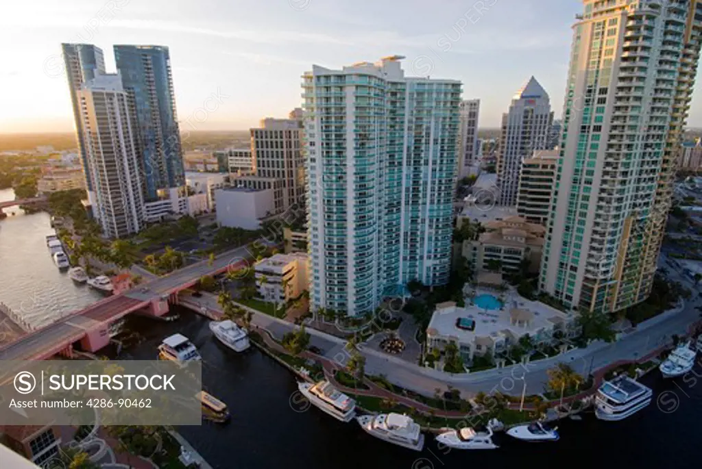 Highrise office towers and condominiums tower over New River in downtown Ft. Lauderdale, FL 
