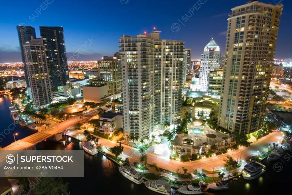 Highrise office towers and condominiums tower over New River in downtown Ft. Lauderdale, FL