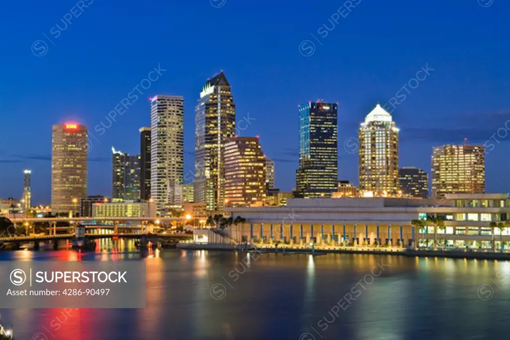  Tampa, Florida, skyline reflecting in Tampa Bay at dusk 