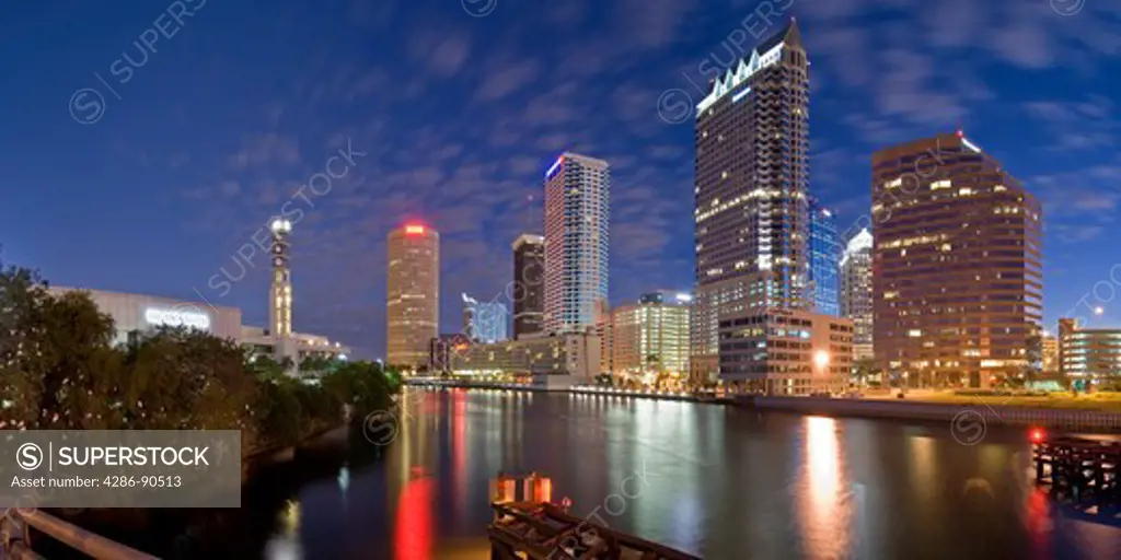Panoramic view of Tampa, Florida, skyline reflecting in Hillsborough River at dusk