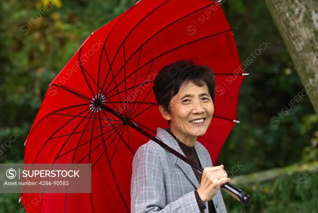 Woman with umbrella, Yangdang Mountains, Zhejiang Province, China