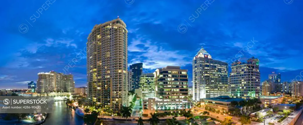 High-rise office towers and condominiums tower over New River in downtown Ft. Lauderdale, FL 