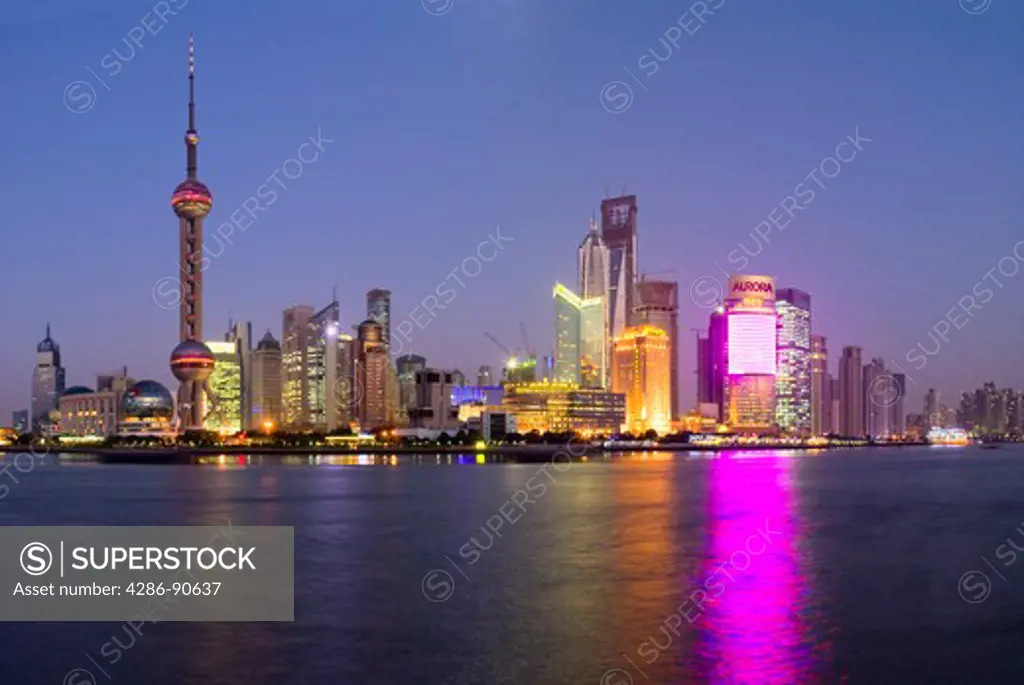 Night time Pudong district skyline overlooking Huangpu River, Shanghai, China