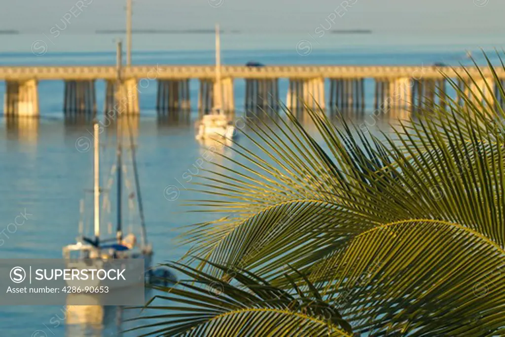 Sail boats anchor at sunset alongside Overseas Highway, Bahia Honda State Park, the Florida Keys, Florida
