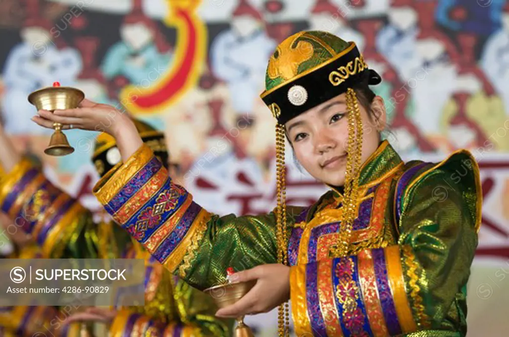 Performers in traditional Mongolian costumes entertain tourists, Xiwuzhumuqinqi, Inner Mongolia, China