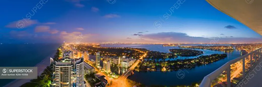 Looking South from high rise, Collins Avenue and Atlantic Ocean at dusk, Miami Beach, Florida, USA