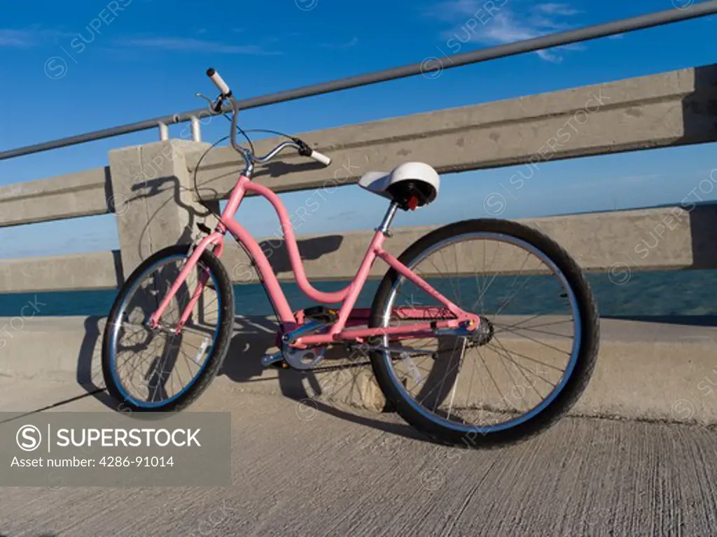 Pink bicycle on highway bridge, Bahia Honda State Park, Florida Keys, Florida, USA