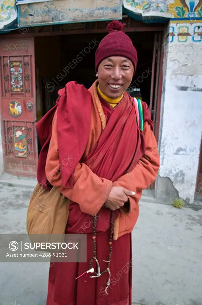 Tibetan Buddhist monk pilgrim visits , Tagong Monastery, Sichuan Province, China