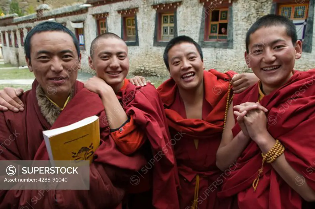 Young Tibetan Buddhist monks visit after morning prayers, Juli Monastery, Xinduqiao, Sichuan Province, China