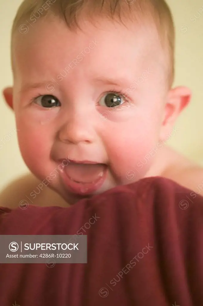 6 month old boy crying on mothers shoulder  MR-0518 MR-0517