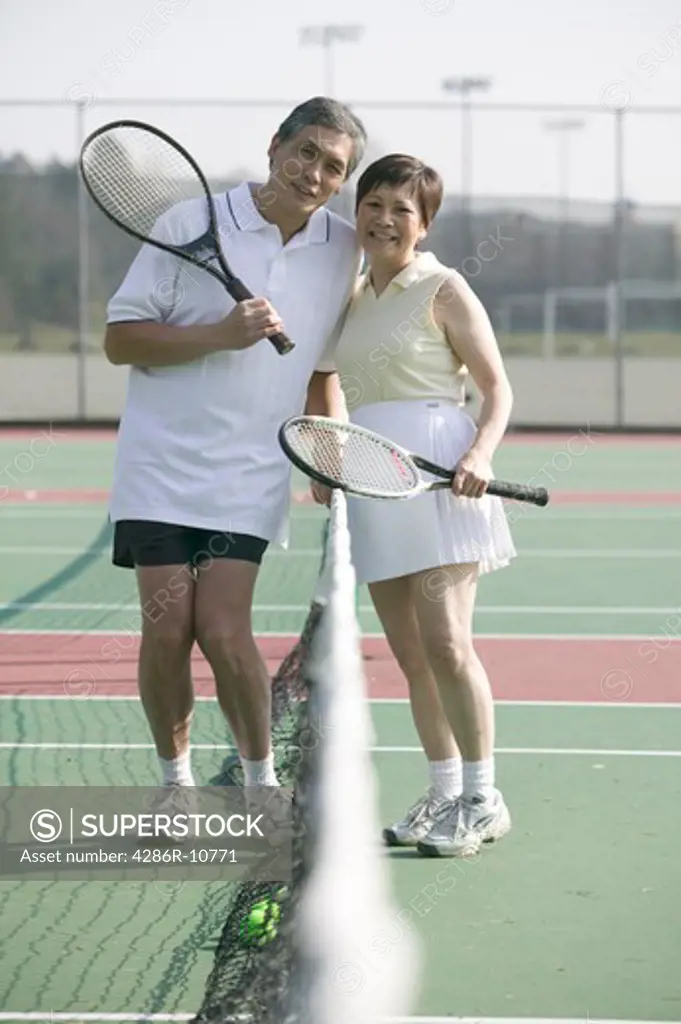 Senior Asian couple and tennis.