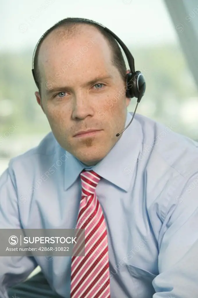 Businessman with cordless headset.  PR