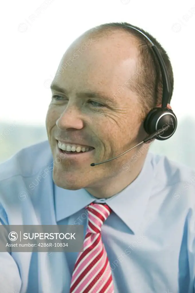 Businessman with cordless headset.  PR