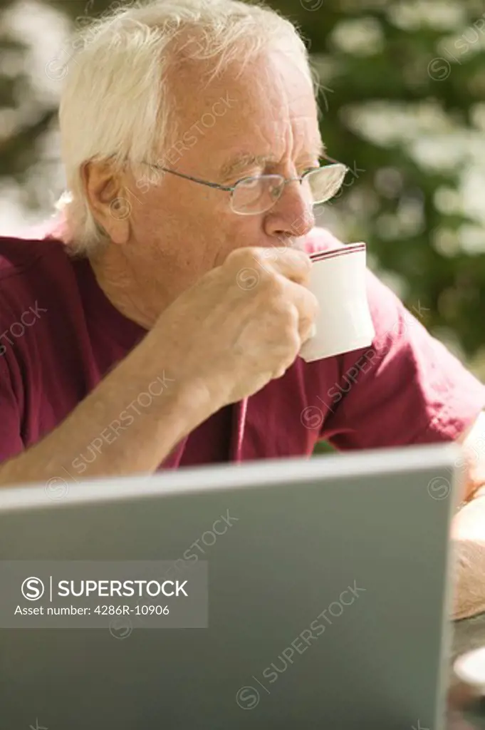 Senior caucasian male with laptop computer.
