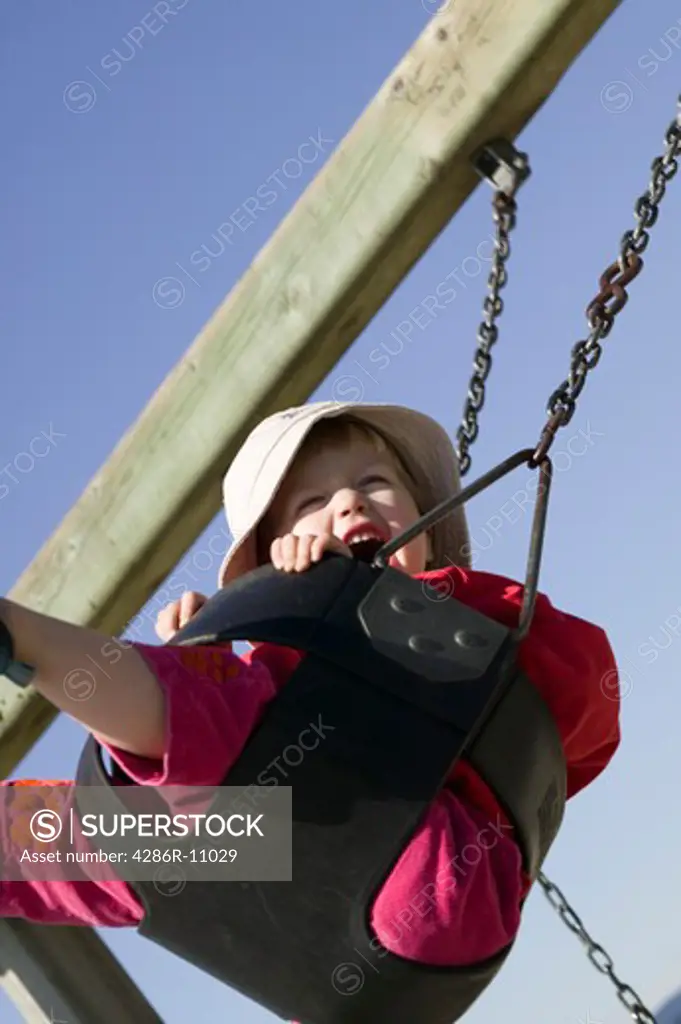 2 year old girl on park swing.MR-0401
