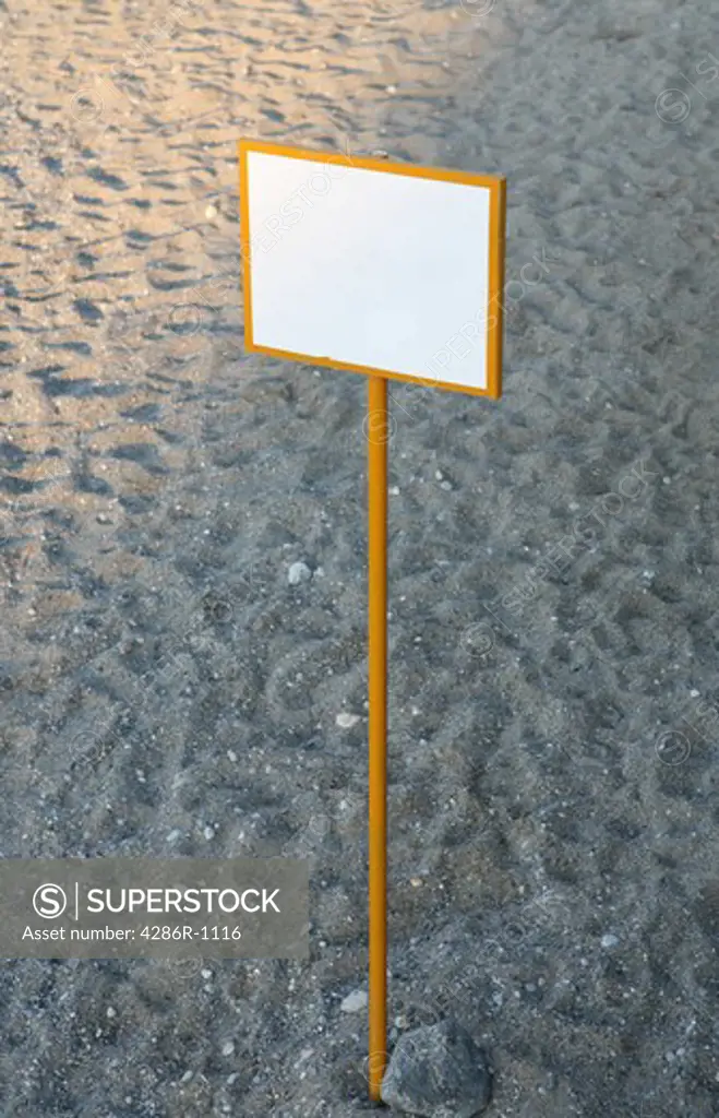 Blank sign on a clean beach