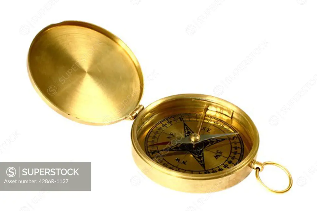 A 1940s brass compass on a white background. The whole of the engraved base is in focus (Scheimpflug effect).