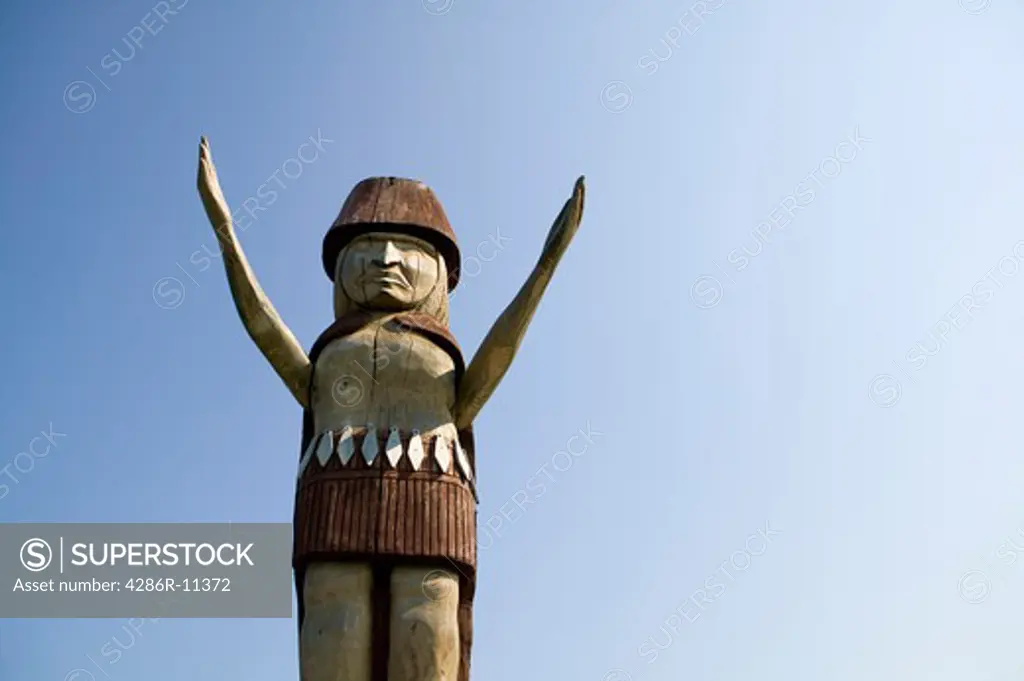 Welcome totem pole at Ambleside Beach, West Vancouver, British Columbia, Canada.-