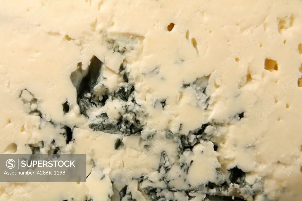 Macro of the texture of Danish Blue cheese.