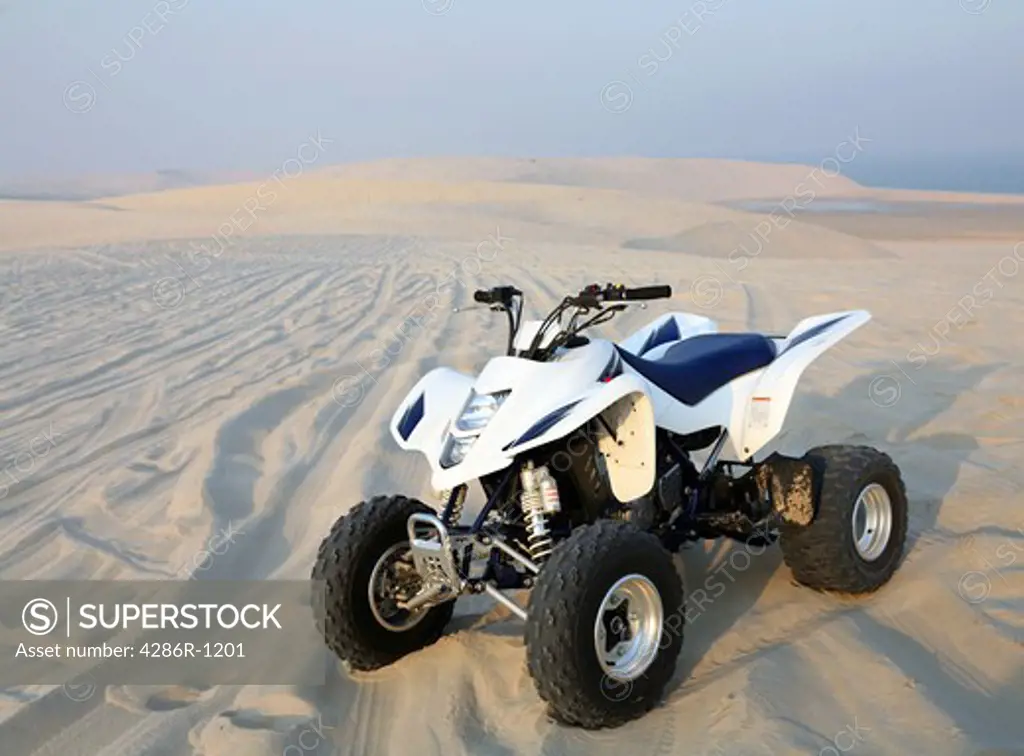 A quadbike in the middle of the Qatari desert.