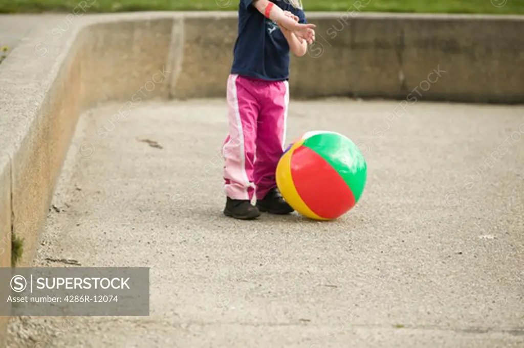 4 Year Old Girl Playing With a Beachball at a Playground, MR-0601