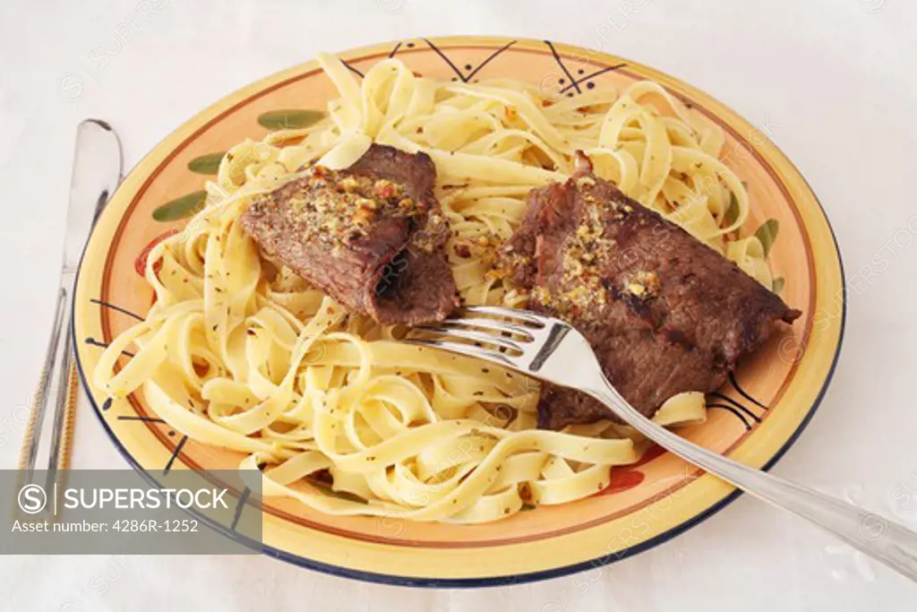 Beef escaopes with pasta and fettucini