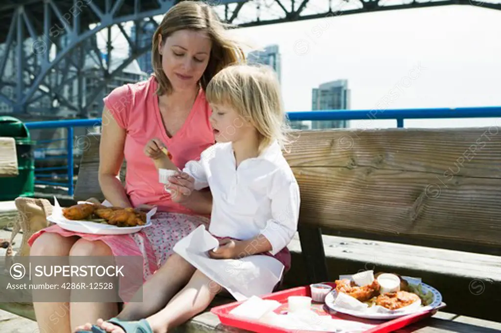 Mom And Daughter Having a Fish and Chips Lunch on Granville Island Vancouver, MR-0601 MR-0637