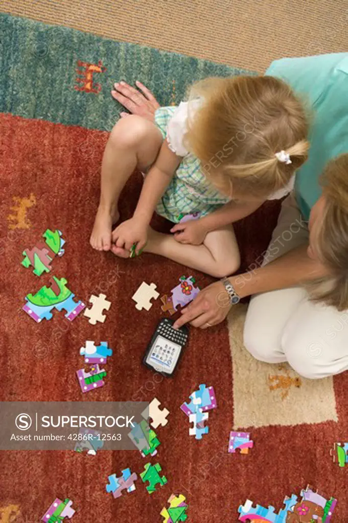Mom Helping With a Jigsaw Puzzle, Blackberry Device Nearby, MR-0652 MR-0653 PR-0655