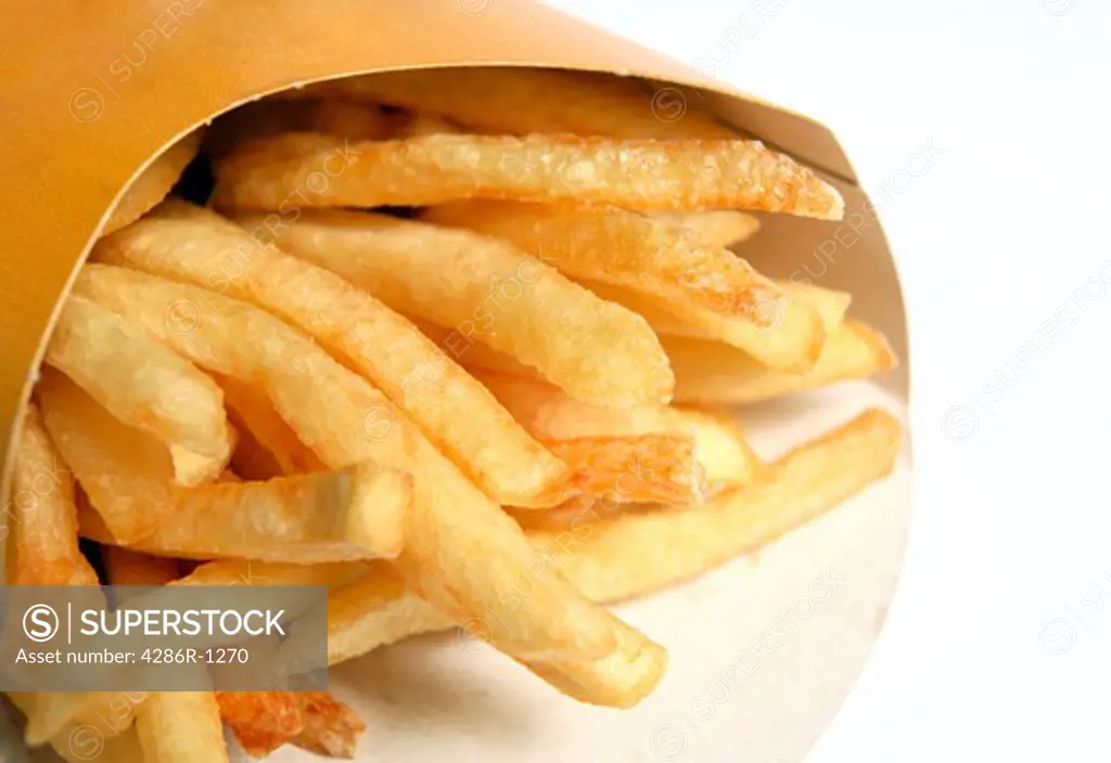 A packet of typical fast-food restaurant french fried potatoes or chips.