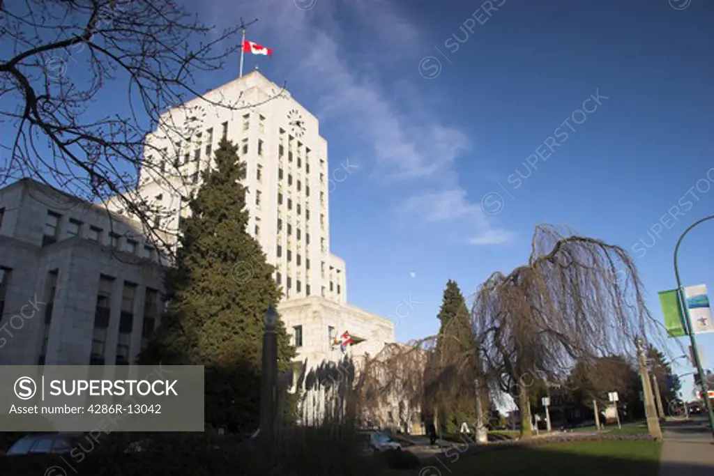 Vancouver City Hall landscape with Canada Flag on clear winter day - Vancouver BC