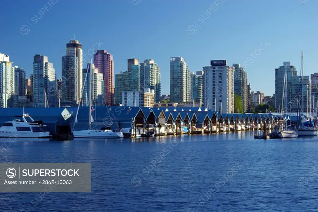 Rows of covered boat docks, Coal Harbour, Vancouver, as seen from Stanley Park