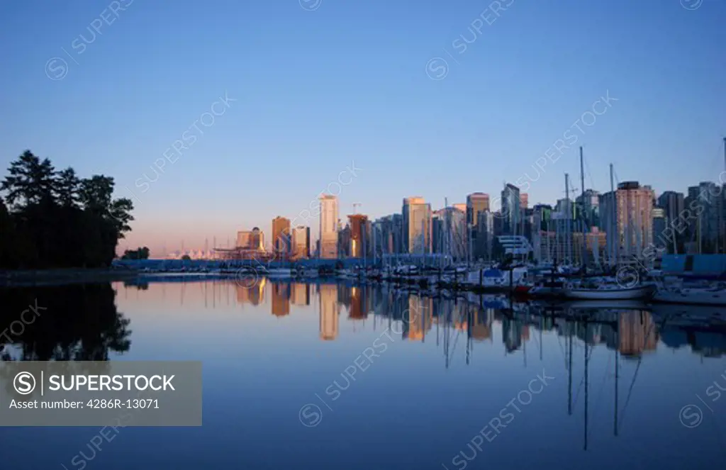 View of Vancouver skyline looking from Stanley Park and marina near sunset