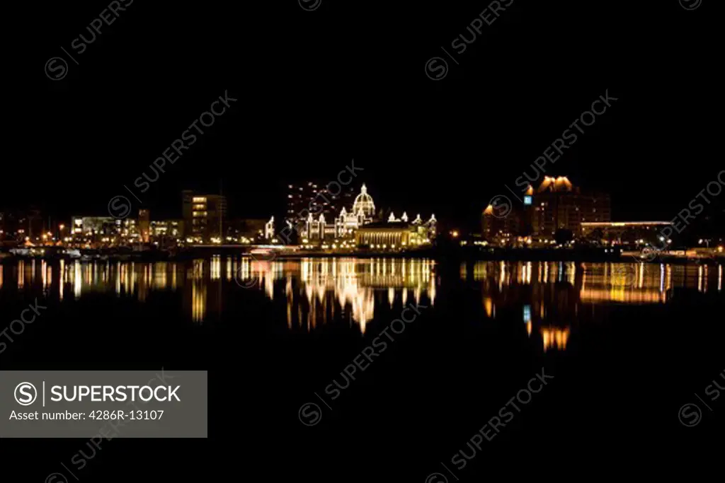 Lights of the inner harbour reflected at night - Victoria, BC, Canada.