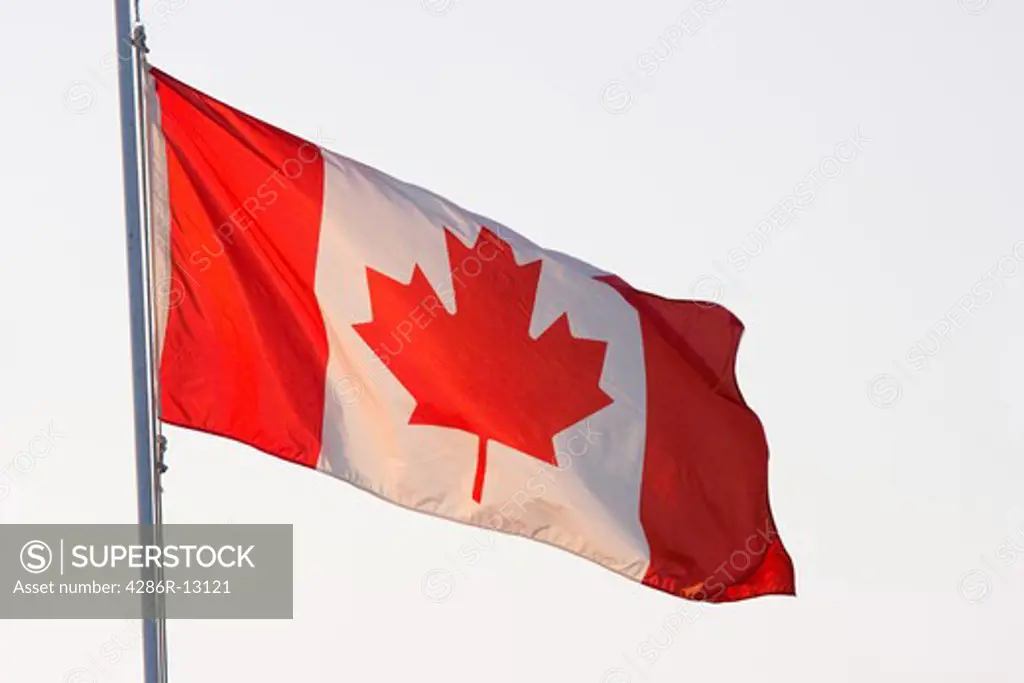 Backlit Canadian Flag flying on Canada Day, July 1