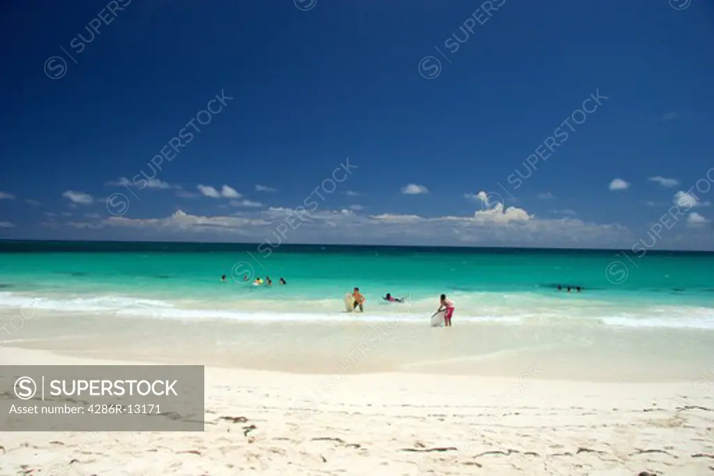 Kids enjoying the  sun at sand at Sun Bay, Vieques Island, Puerto Rico
