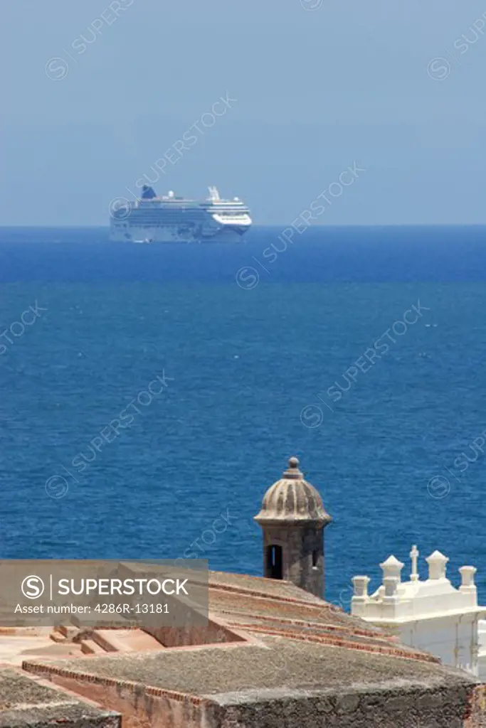 Cruise ship appears behind the Castillo de San Felipe del Morro in old San Juan, Puerto Rico