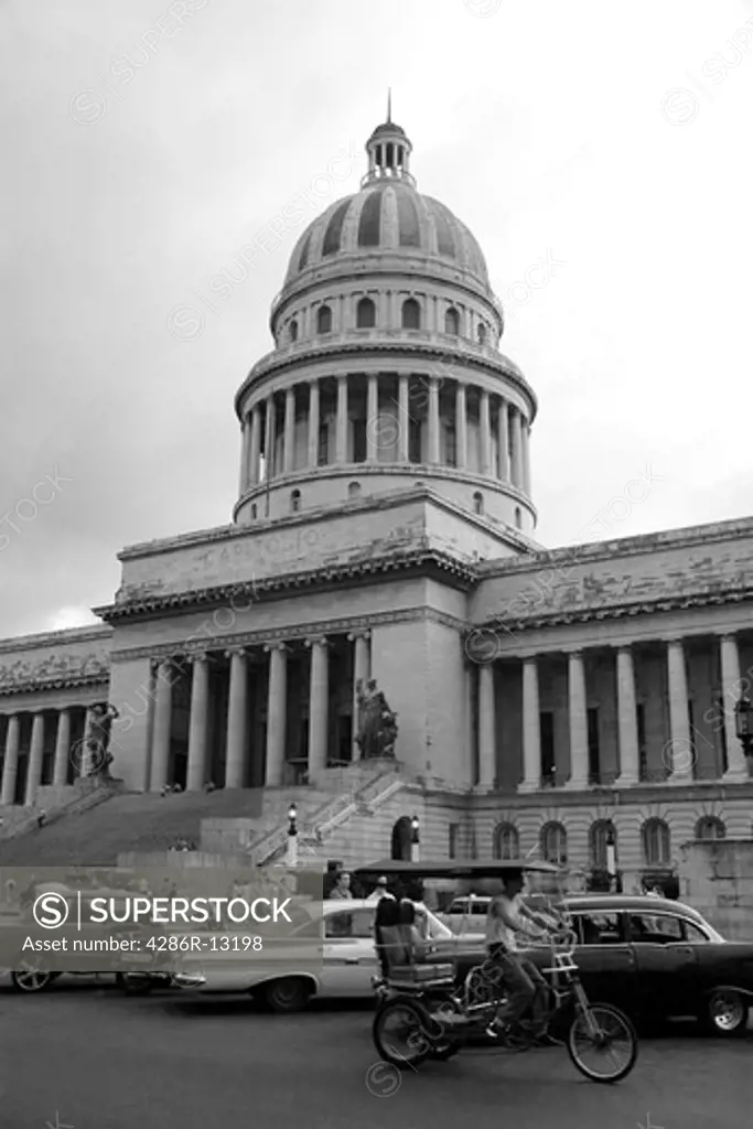Cars and pedicab in front of the Capitolio Nacional, Old Havana, Cuba