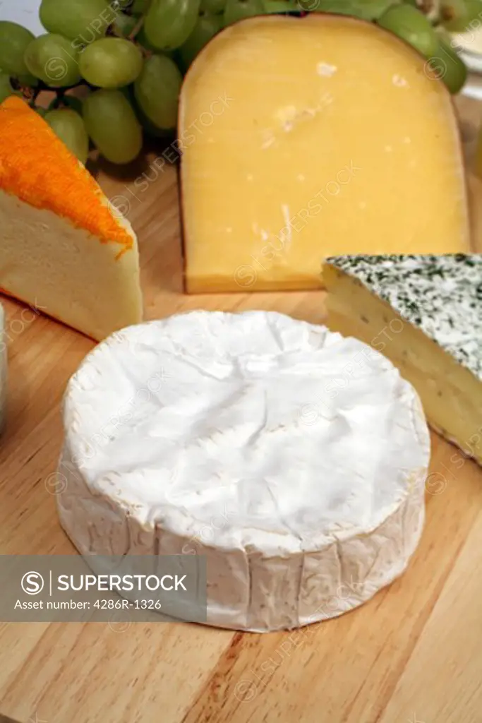 cheeseboard; brie; blue; blue cheese; cambozola; cheese; french; soft; creamy; fat; fattening; gourmet; delicacy; delicious; diet; herb; wedge;
