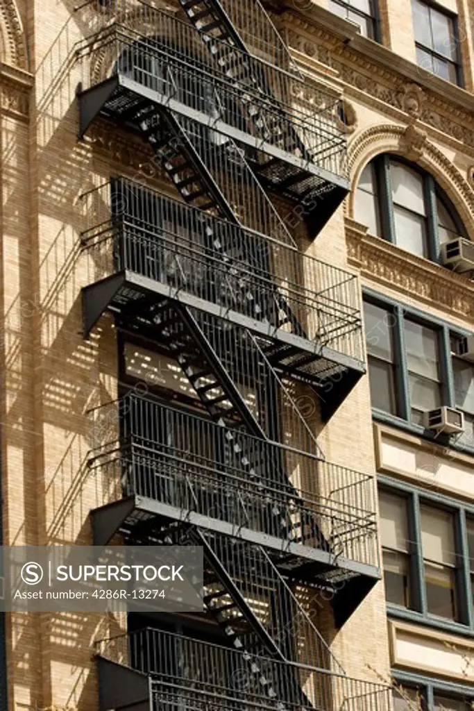 exterior metal fire escape on apartment building, Manhattan, New York