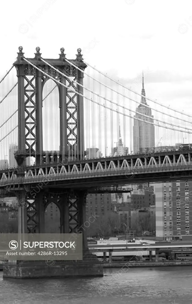 Black and White -  Manhattan Bridge and Empire State Building from the walkway on the Brooklyn Bridge, New York