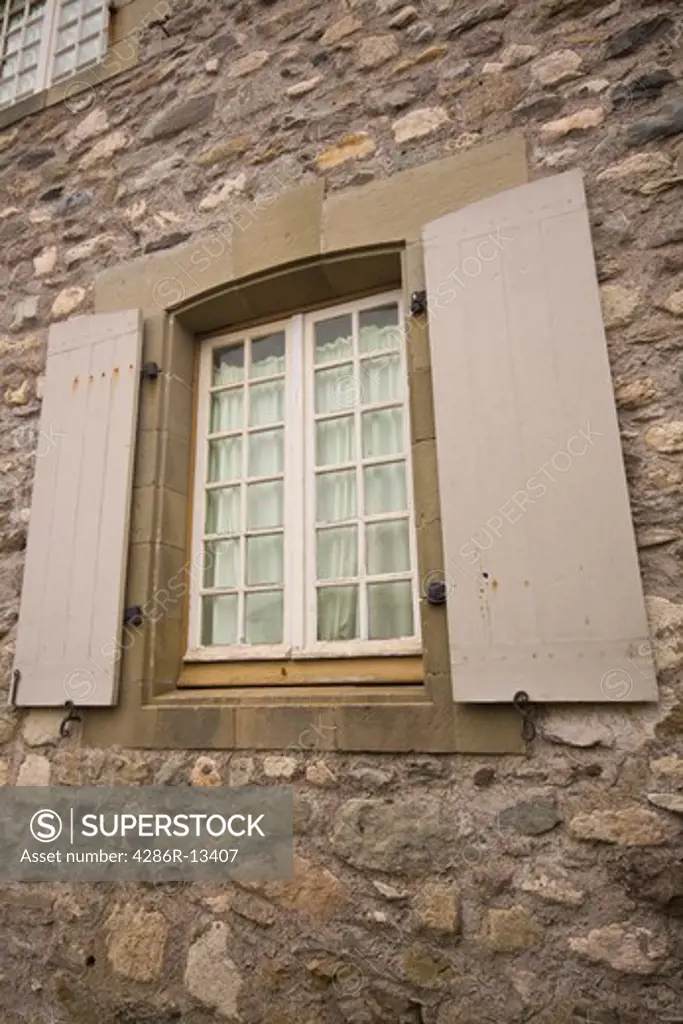 18th century windows and shutters on stone building at Fortress of Louisbourg National Historic Site, Cape Breton, Nova Scotia, Canada