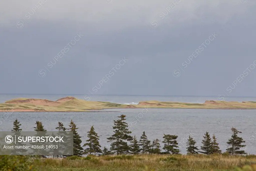 Sand dunes extend across London Bay, near Cavendish, Prince Edward Island National Park, on the north shore of Prince Edward Island, Canada