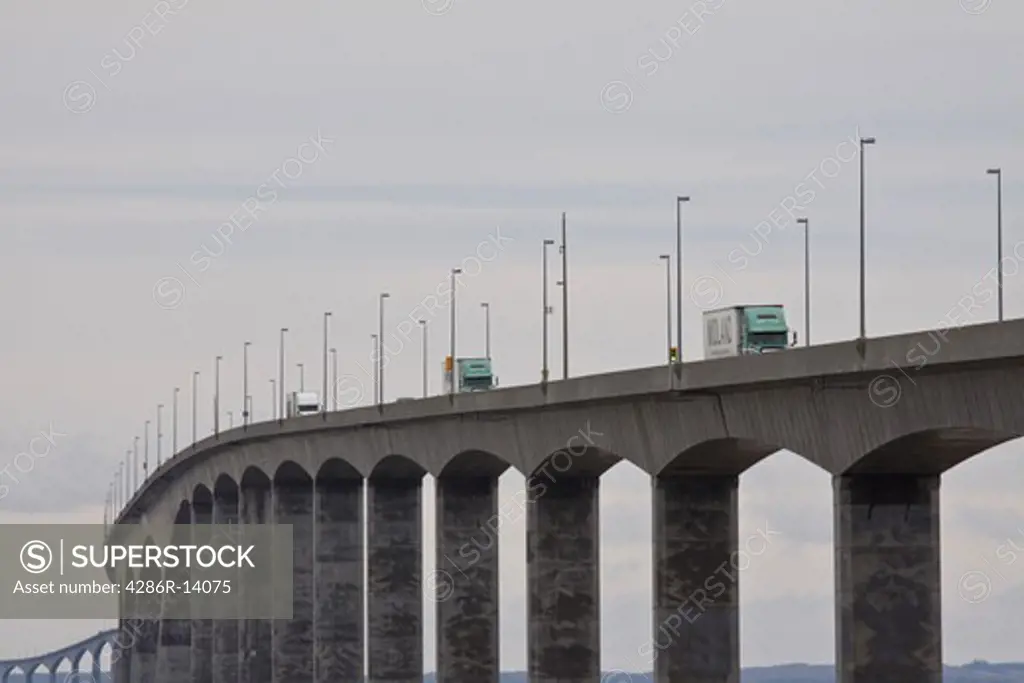 Trucks drive across the 13 Km long Confederation Bridge, linking Prince Edward Island to New Brunswick, Canada