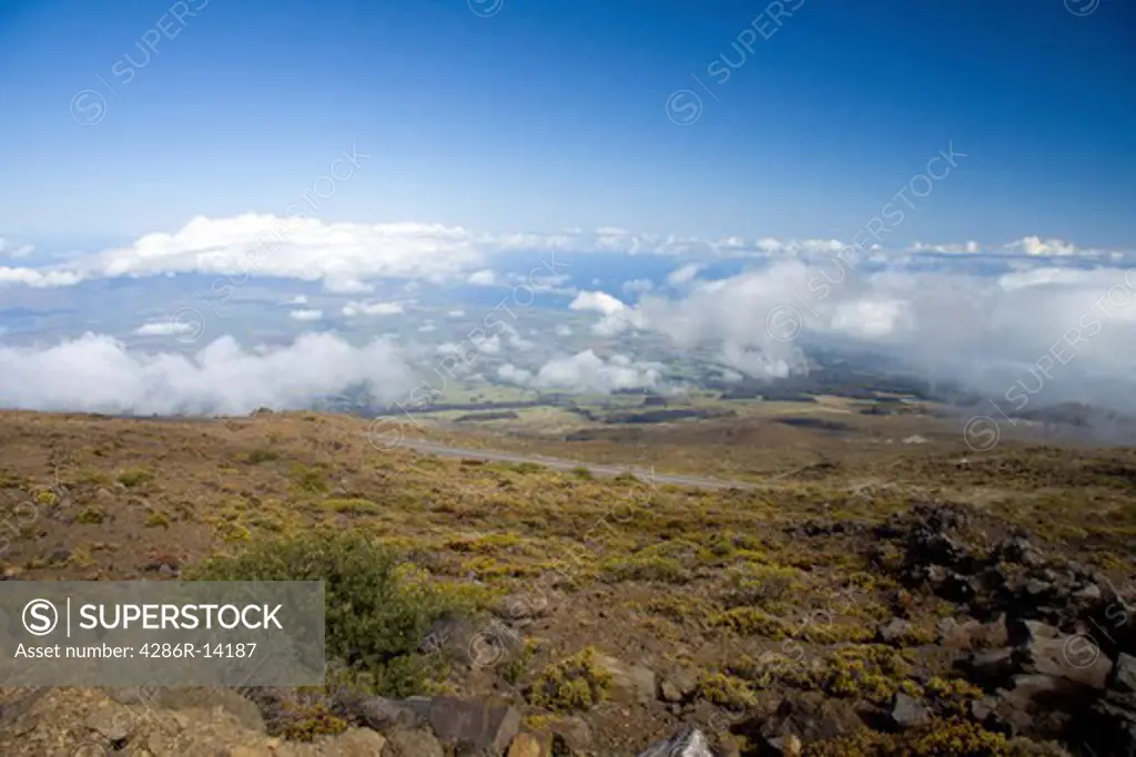 View from the Haleakala highway in Haleakala National Park, looking down onto the island of Maui