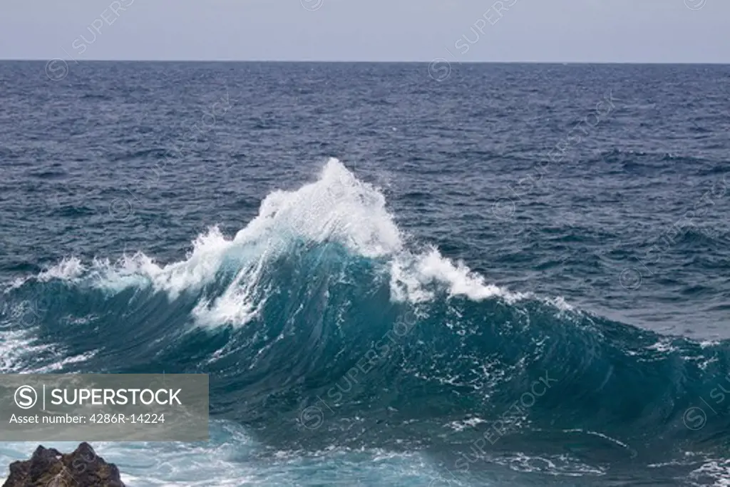 Ocean wave looks like a snow capped mountain, Maui, Hawaii