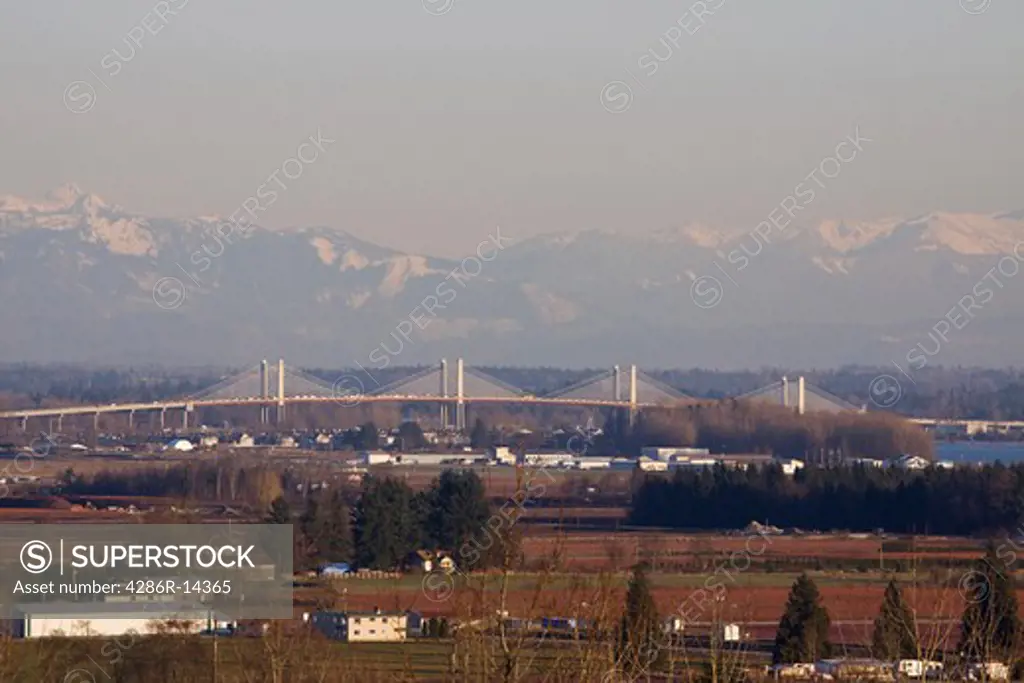 New Golden Ears Bridge 2009 over the Fraser River between Maple Ridge and Langley, BC. Pitt Meadows airport is in front of the bridge.