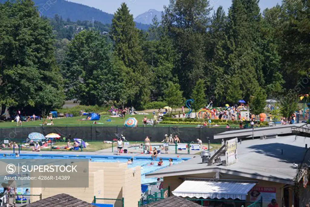Ovherhead view of swimming pool and spray park at Rocky Point Park, Port Moody, BC, Canada.