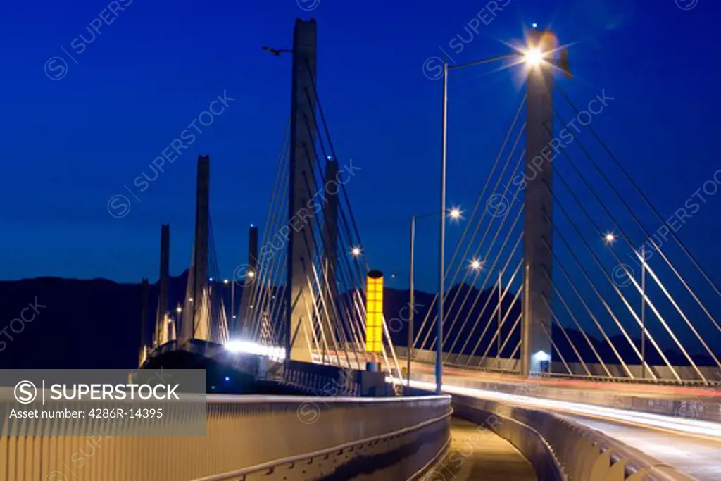 Golden Ears Bridge with traffic at night, motion blur. Between Langley and Maple Ridge, BC, Canada.