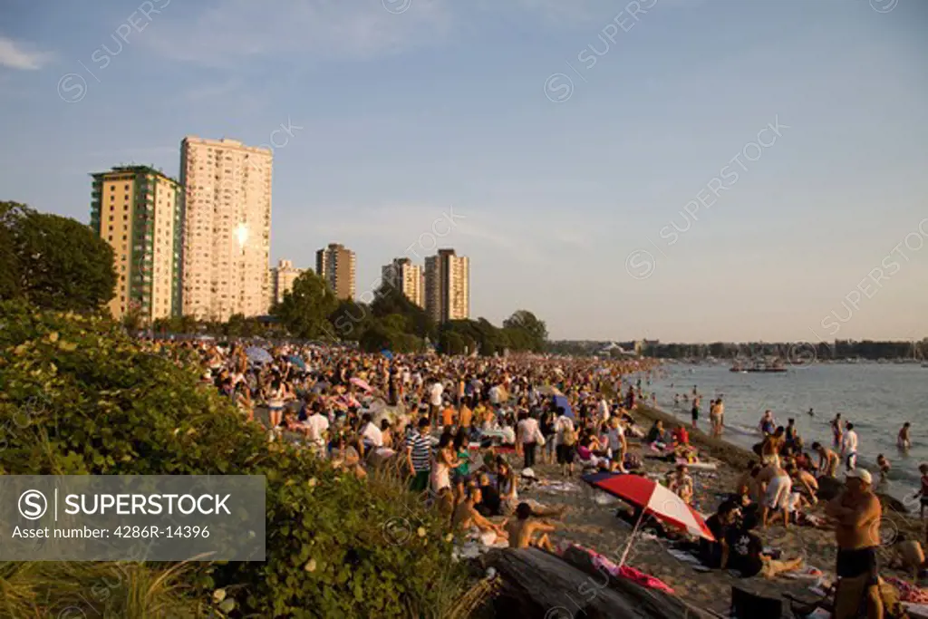 Multi-cultural crowd gathers at Sunset on English Bay, Vancouver