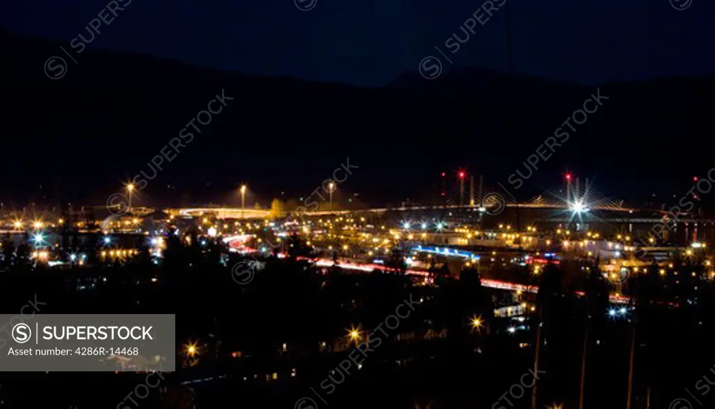 Night view of Mary Hill Industrial Estate, Mary Hill Bypass and new Pitt River Bridge. Port Coquitlam, BC, Canada.